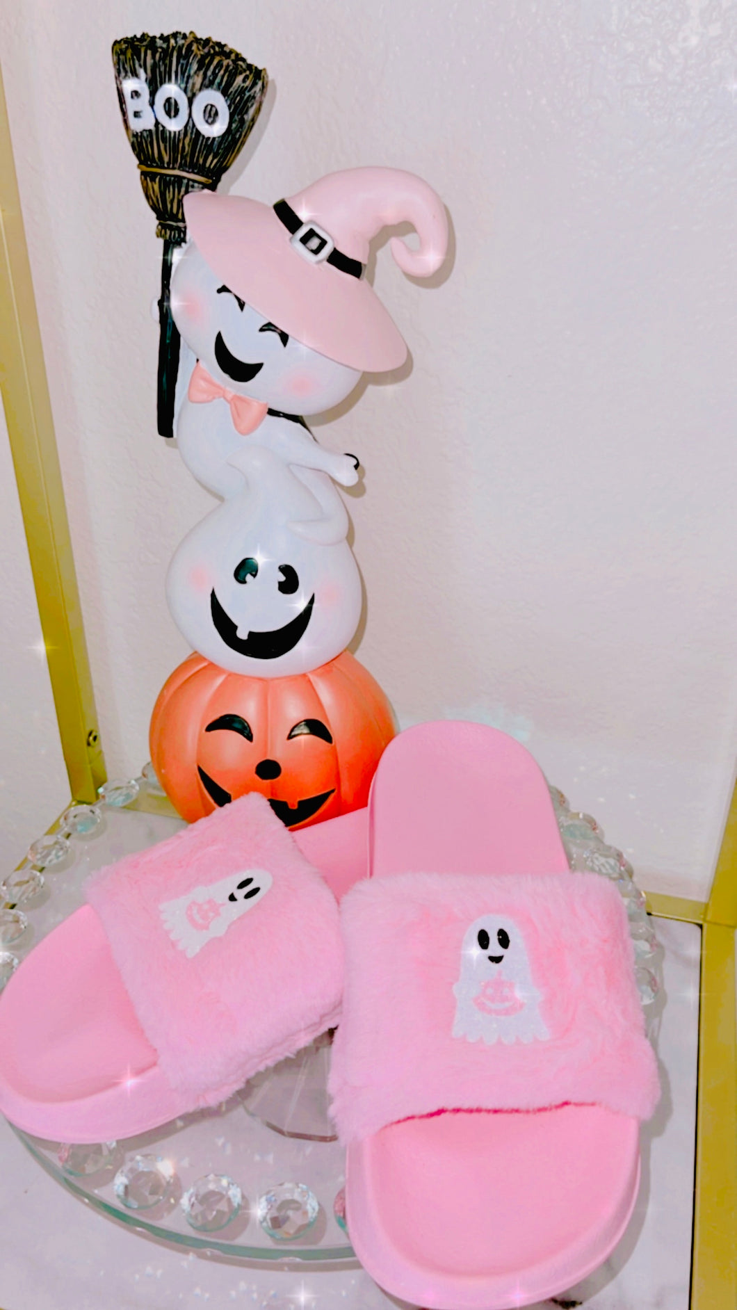 Ghost holding pumpkin slippers